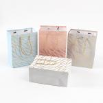Gold Foil Deep Embossed Paper Gift Bags For Festivals Gifting Business Favors for sale