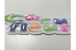 China Sustainable Custom Sparkling Pink Yellow TPU Patch Puffy Labels Customized For Clothing supplier
